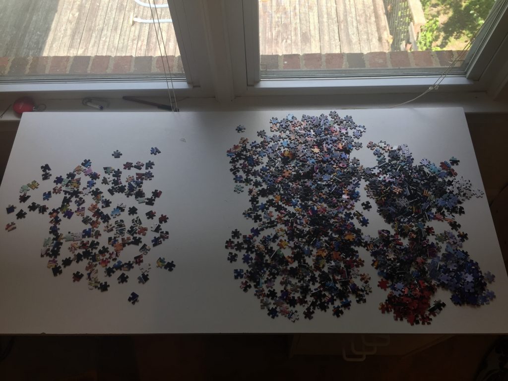 Puzzle pieces spread on a desk showing sample sorting collections.