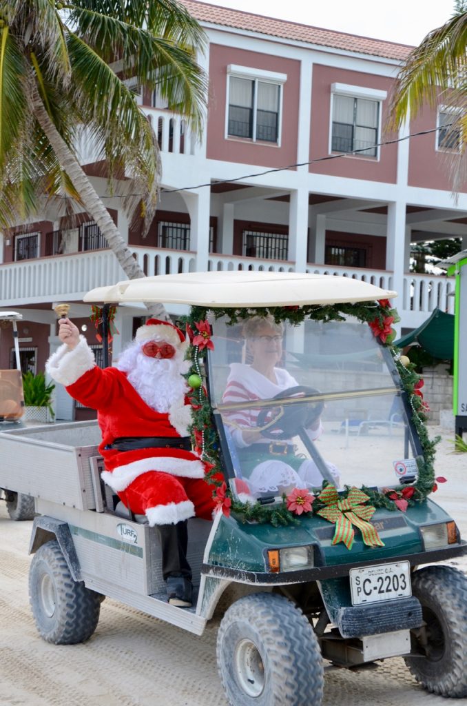 Santa and Ms. Clause in a golf cart