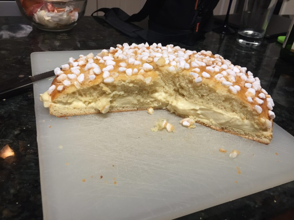 A pastry with a cream filling. About 1/2 consumed.