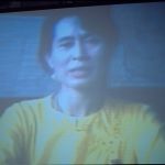 Picture of Aung San Suu Kyi projected on a screen.